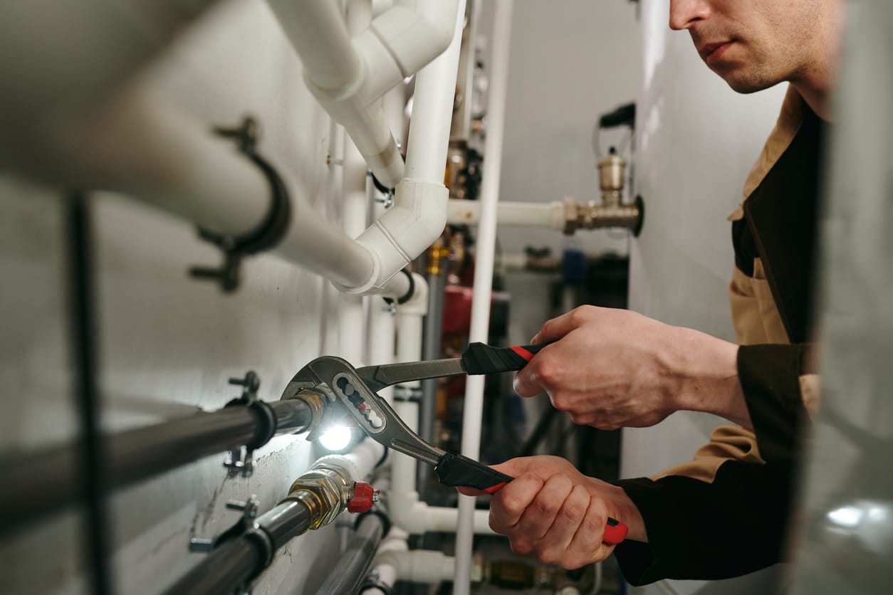 Plumbers maintaining commercial plumbing pipes in Bethel Park