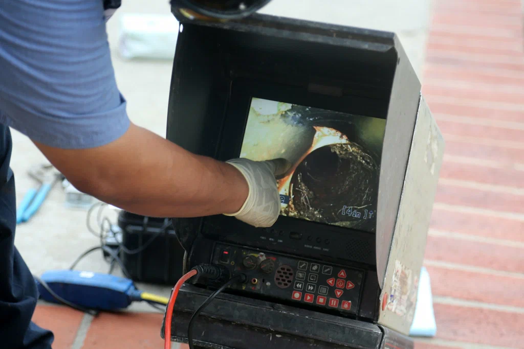 Technician viewing a drain inspection camera in Bethel Park